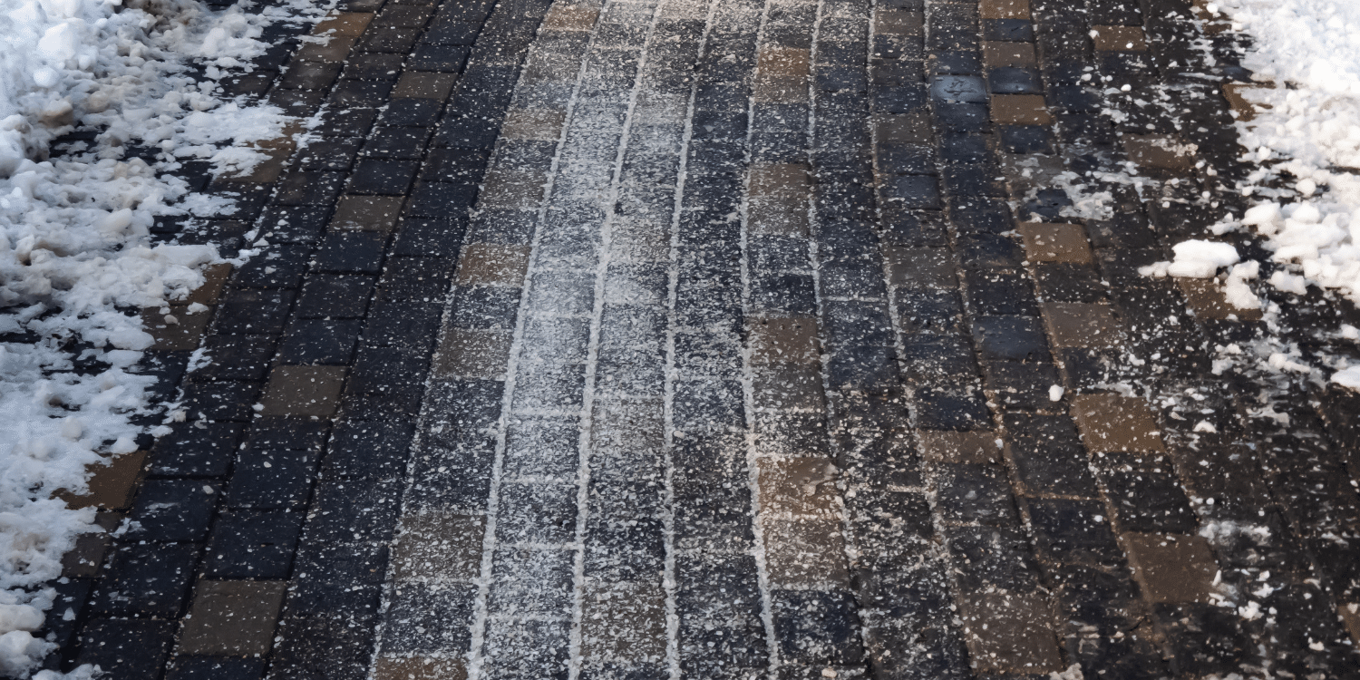 Salt Spread On Interlocking Walkway - Ultimate Guide to Salt & De-Icers: Expert Advice on Choosing and Using Ice Melters